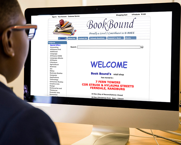 snapplify_cloud_services_paragraph_image_2 - snapplify cloud services School-aged child in uniform, looking at the BookBound website on a computer