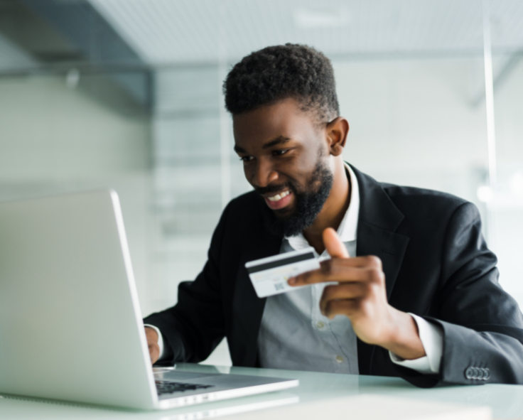 snapplify-cloud-services-pay-partner-2 - snapplify cloud services Businessman using a credit card to make an online payment on a laptop